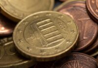 a close up of a pile of coins