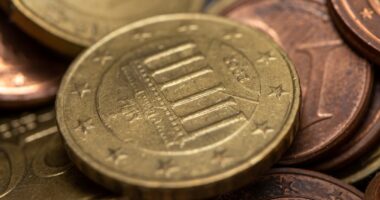 a close up of a pile of coins